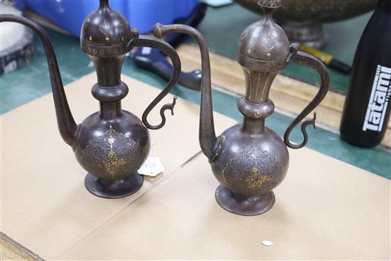 A pair of 19th century Qajar gold inlaid iron rosewater sprinklers, H.12.5in.